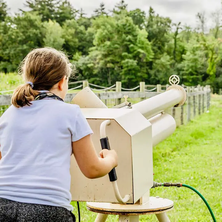 Girl shooting apple canon